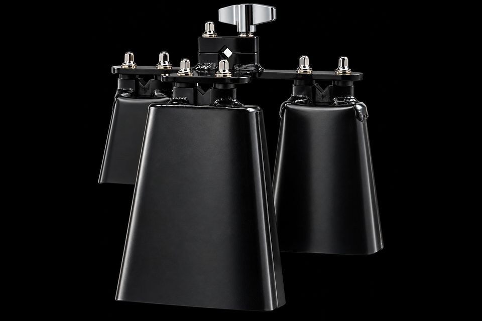 Three black cowbells on a mounting bracket